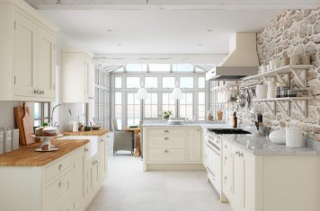 Traditional in-frame cream painted oak shaker kitchen with wood and granite